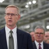FILE PHOTO: Outgoing CEO of Jaguar Land Rover, Adrian Mardell, speaks as Britain’s Prime Minister Keir Starmer, looks on