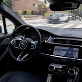 FILE PHOTO: A self-driving Waymo car drives through Los Angeles