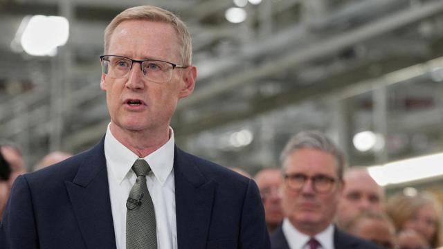 FILE PHOTO: Outgoing CEO of Jaguar Land Rover,  Adrian Mardell, speaks as Britain’s Prime Minister Keir Starmer, looks on