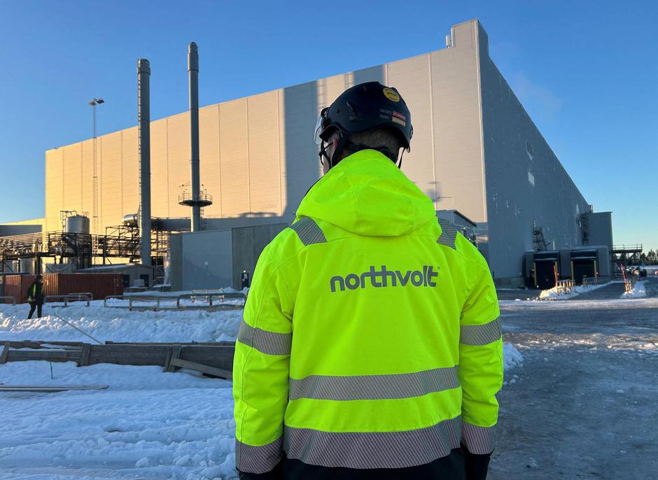 FILE PHOTO: A man stands in front of the Northvolt Ett factory in Skelleftea, Sweden | Author: MARIE MANNES/REUTERS