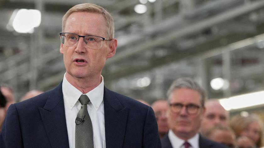FILE PHOTO: Outgoing CEO of Jaguar Land Rover,  Adrian Mardell, speaks as Britain’s Prime Minister Keir Starmer, looks on